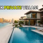 Ultra-luxury Palm Jumeirah beachfront private pool villa overlooking the Dubai skyline at sunset